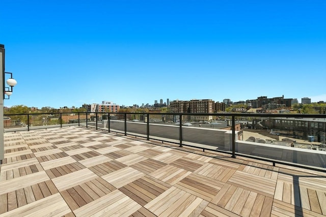 view of patio / terrace with a city view and a balcony