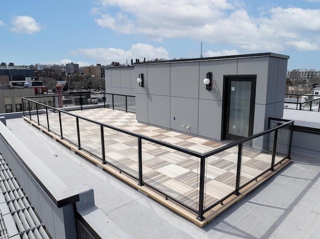 view of patio featuring a view of city and a balcony