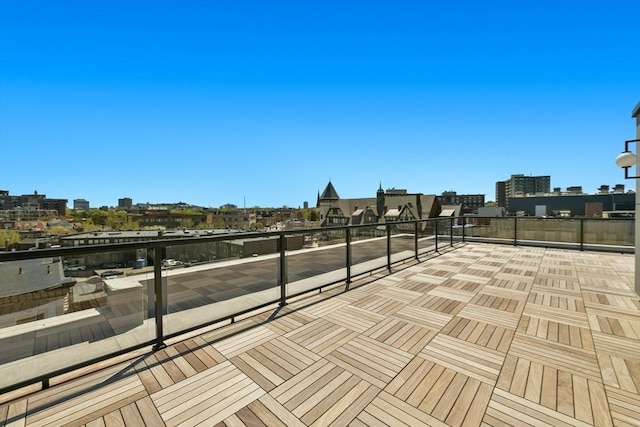 view of patio featuring a view of city and a balcony