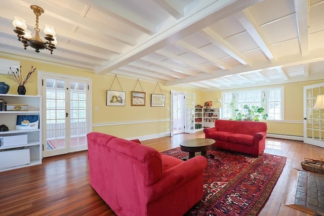 living room with beam ceiling, baseboards, hardwood / wood-style floors, and french doors