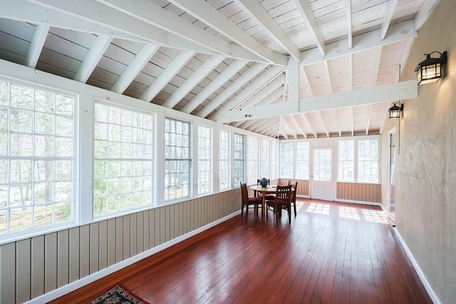 sunroom / solarium with vaulted ceiling with beams and wooden ceiling