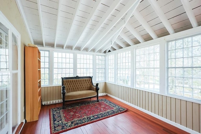 sunroom with lofted ceiling with beams and wooden ceiling