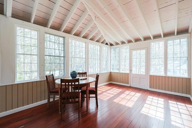 sunroom / solarium with vaulted ceiling with beams and wooden ceiling