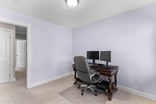 carpeted home office with baseboards