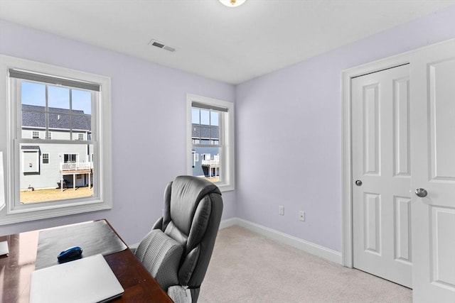 home office with visible vents, baseboards, and carpet