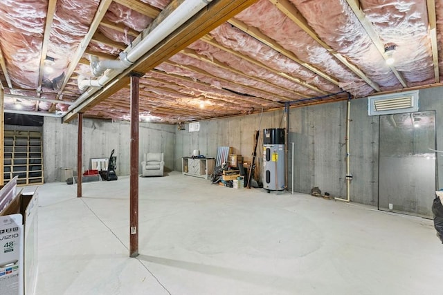 unfinished basement with hybrid water heater