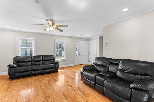 living area with recessed lighting, baseboards, light wood-style floors, and ornamental molding