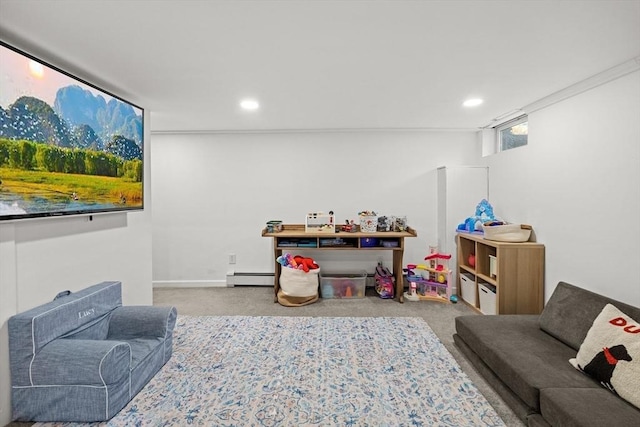 recreation room with carpet floors, recessed lighting, and baseboard heating