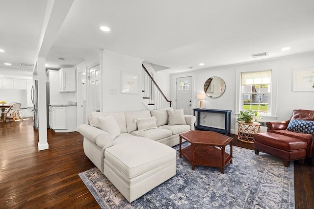 living room with crown molding, stairs, recessed lighting, visible vents, and dark wood-style floors