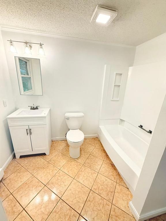 212 Fountain St Unit A, Framingham, MA 01702 - full bath with vanity, a textured ceiling, and tile patterned floors
