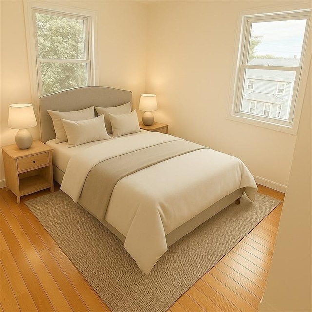 212 Fountain St Unit A, Framingham, MA 01702 - bedroom featuring multiple windows and light wood-style flooring