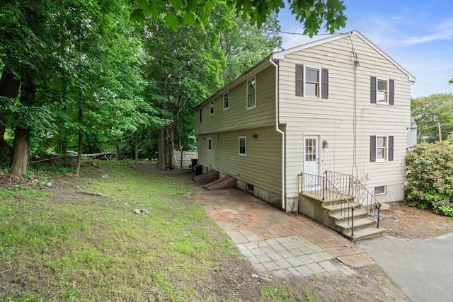 212 Fountain St Unit A, Framingham, MA 01702 - view of side of property featuring a patio area