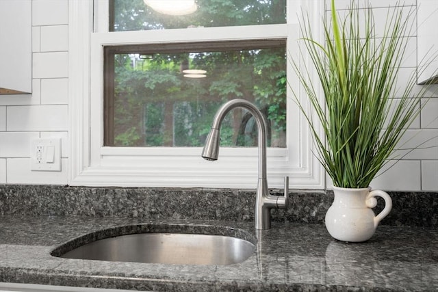 212 Fountain St Unit A, Framingham, MA 01702 - kitchen view of dark stone counters and tasteful backsplash