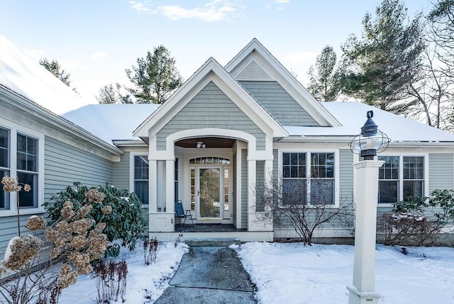 view of snow covered property entrance