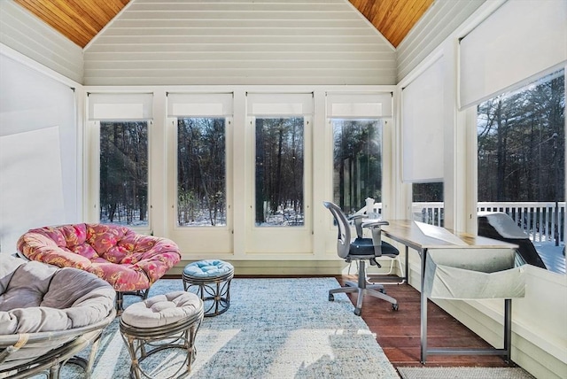 sunroom featuring vaulted ceiling and wooden ceiling