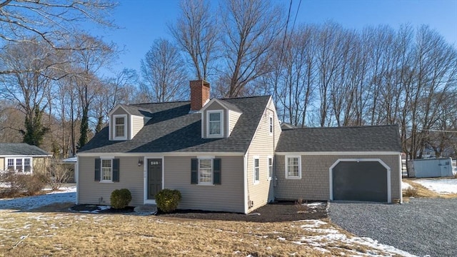 cape cod-style house with a garage