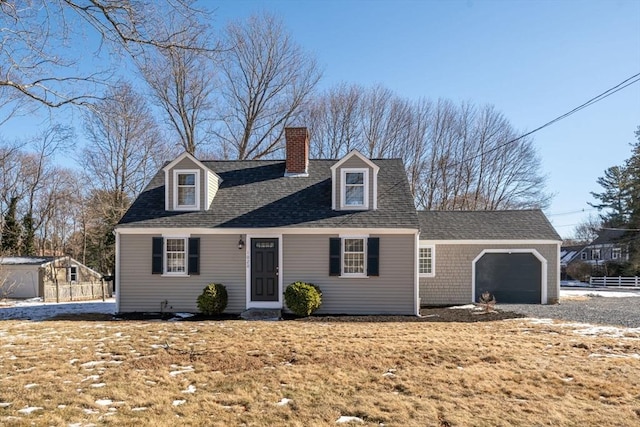 new england style home featuring a garage and a front yard