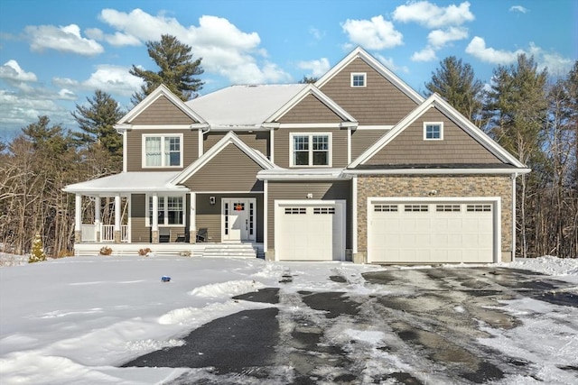 view of front facade featuring a porch and a garage