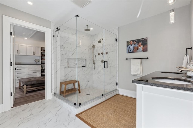 bathroom with an enclosed shower and vanity