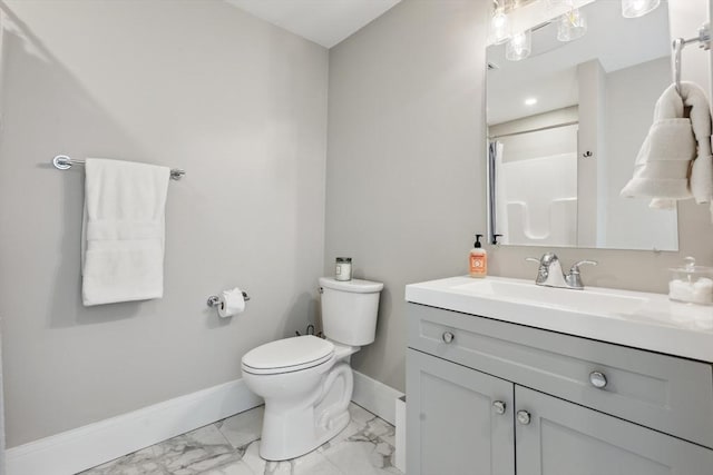 bathroom with walk in shower, vanity, and toilet