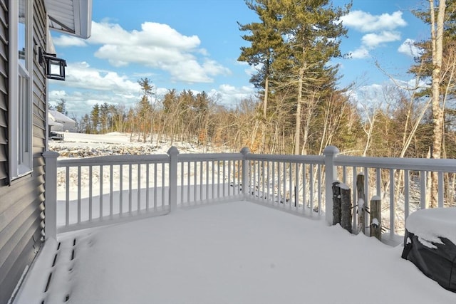 snow covered deck with grilling area