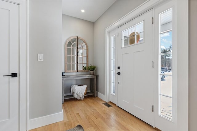 foyer with light hardwood / wood-style floors