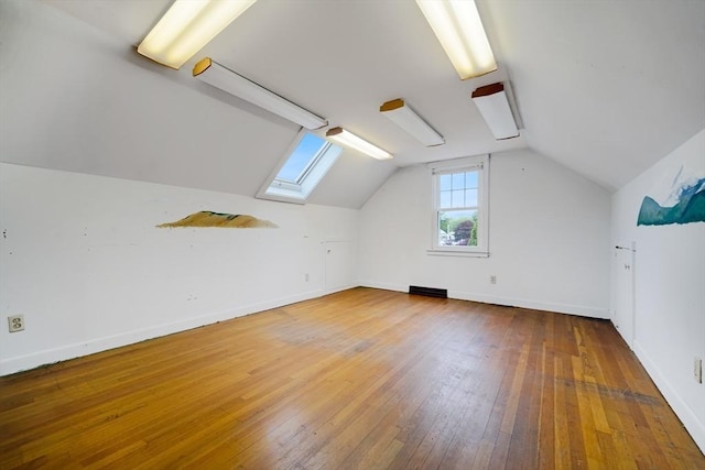 209 Sharp St, Dartmouth, MA 02747 - bonus room with a skylight, hardwood / wood-style floors, lofted ceiling, and baseboards