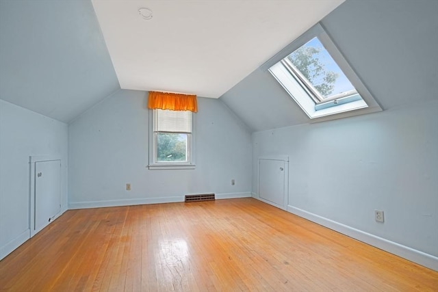 209 Sharp St, Dartmouth, MA 02747 - bonus room featuring wood-type flooring, a skylight, lofted ceiling, and baseboards