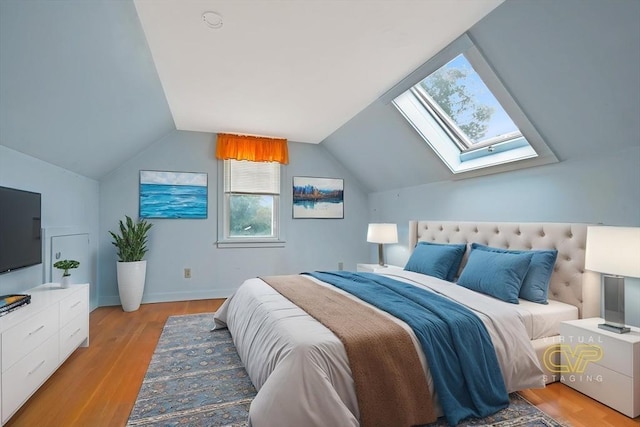 209 Sharp St, Dartmouth, MA 02747 - bedroom featuring a skylight, light wood-type flooring, vaulted ceiling, and baseboards