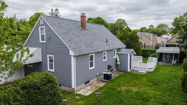 209 Sharp St, Dartmouth, MA 02747 - rear view of property featuring central air condition unit, a chimney, a lawn, a deck, and roof with shingles