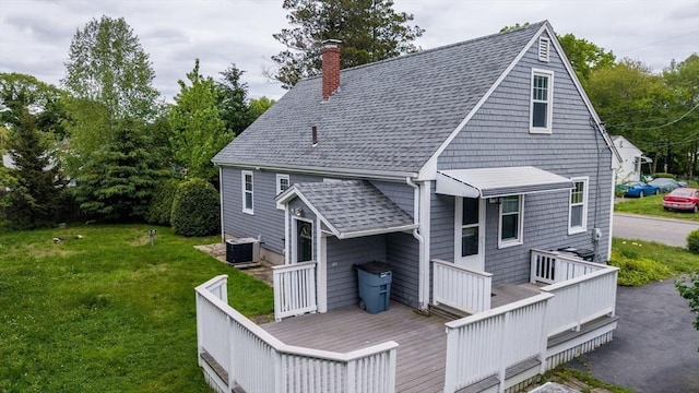 209 Sharp St, Dartmouth, MA 02747 - rear view of property featuring a chimney, roof with shingles, central AC, a yard, and a deck