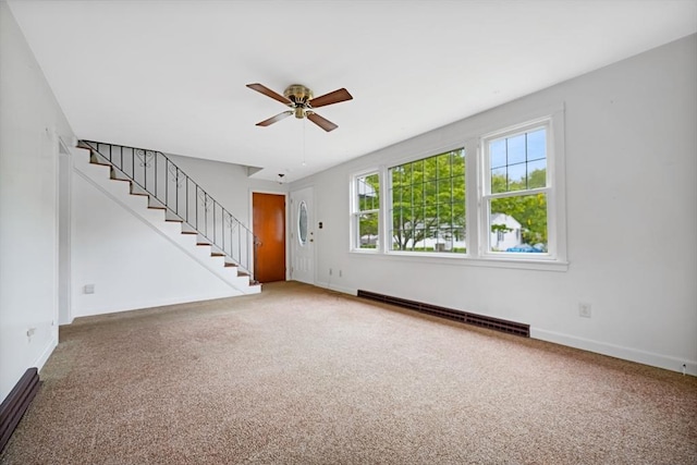 209 Sharp St, Dartmouth, MA 02747 - unfurnished living room with a baseboard heating unit, ceiling fan, carpet flooring, and stairway