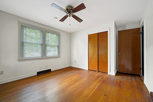 209 Sharp St, Dartmouth, MA 02747 - unfurnished bedroom featuring hardwood / wood-style flooring, baseboards, a closet, and a ceiling fan