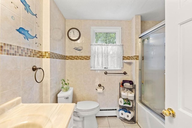 11 Douglas Ave, Burlington, MA 01803 - full bathroom featuring a baseboard radiator, tile walls, tile patterned flooring, toilet, and bath / shower combo with glass door