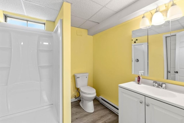 11 Douglas Ave, Burlington, MA 01803 - full bath featuring a baseboard radiator, a paneled ceiling, toilet, wood finished floors, and a shower