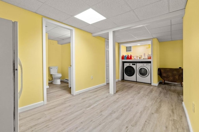 11 Douglas Ave, Burlington, MA 01803 - laundry area featuring wood finished floors, washing machine and clothes dryer, and baseboards