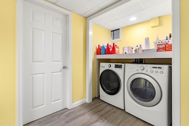 11 Douglas Ave, Burlington, MA 01803 - clothes washing area featuring washing machine and dryer and light wood finished floors