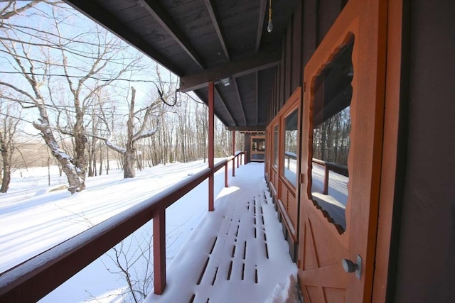 view of snow covered deck