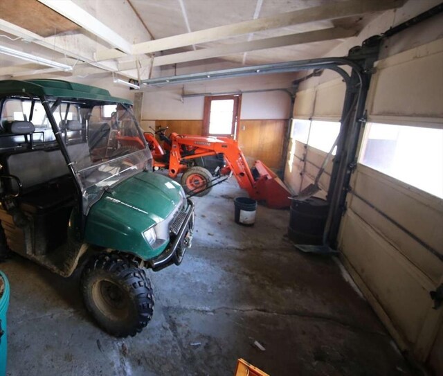 garage featuring wooden walls