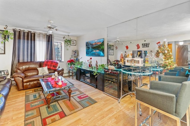 living room with hardwood / wood-style flooring, a baseboard radiator, and beverage cooler