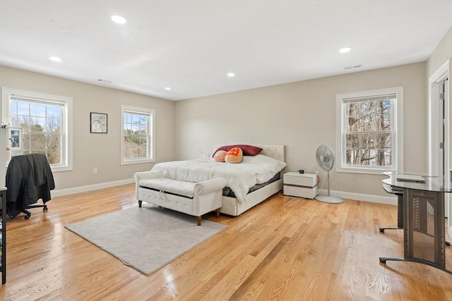 bedroom with light hardwood / wood-style flooring