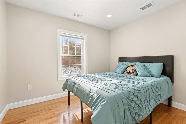 bedroom featuring wood-type flooring