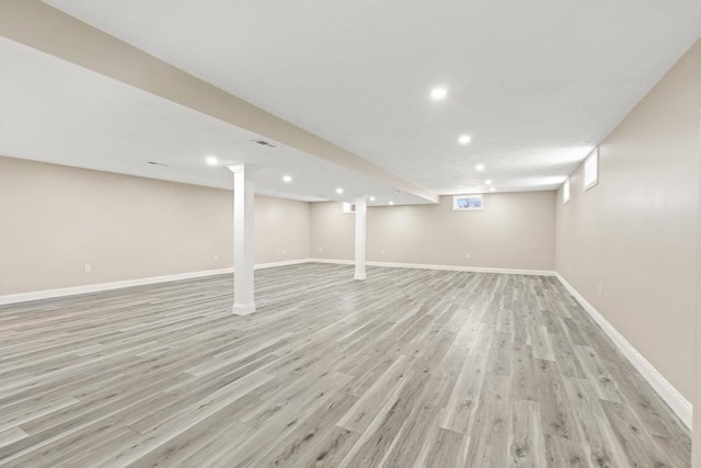 basement featuring light hardwood / wood-style floors