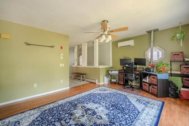 71 Webber Rd, Brookfield, MA 01506 - office space with an AC wall unit, wood finished floors, ceiling fan, and baseboard heating