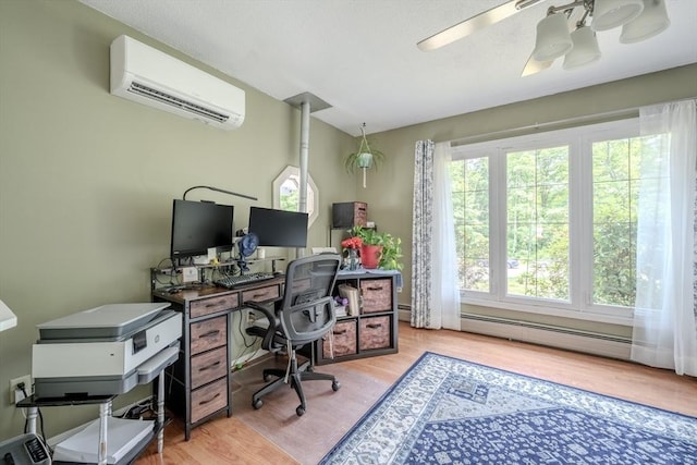 71 Webber Rd, Brookfield, MA 01506 - office space with a wall mounted AC, a baseboard heating unit, wood finished floors, and ceiling fan