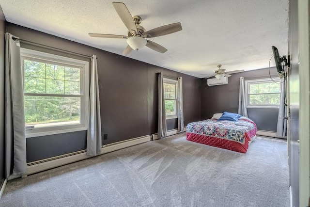 71 Webber Rd, Brookfield, MA 01506 - bedroom featuring a textured ceiling, carpet, a ceiling fan, a baseboard radiator, and a wall unit AC