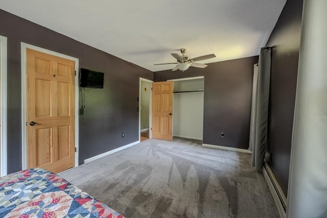 71 Webber Rd, Brookfield, MA 01506 - unfurnished bedroom with a baseboard radiator, carpet floors, a closet, and a ceiling fan