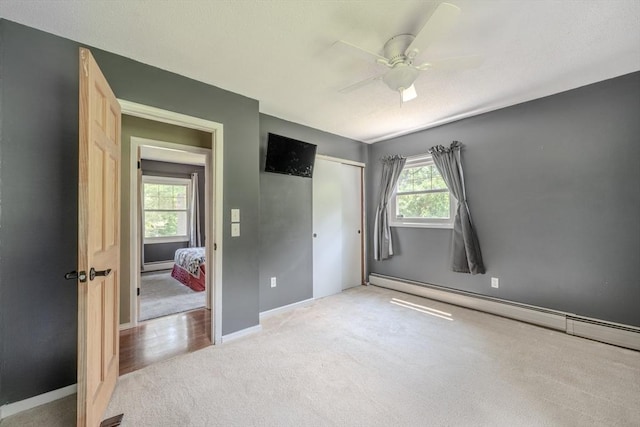71 Webber Rd, Brookfield, MA 01506 - unfurnished bedroom with carpet, a baseboard radiator, a closet, and ceiling fan