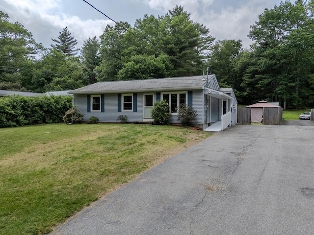 71 Webber Rd, Brookfield, MA 01506 - ranch-style house featuring asphalt driveway, a front lawn, and a shed