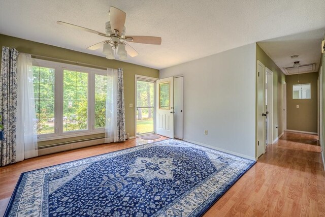 71 Webber Rd, Brookfield, MA 01506 - empty room featuring attic access, a ceiling fan, a baseboard radiator, wood finished floors, and a textured ceiling
